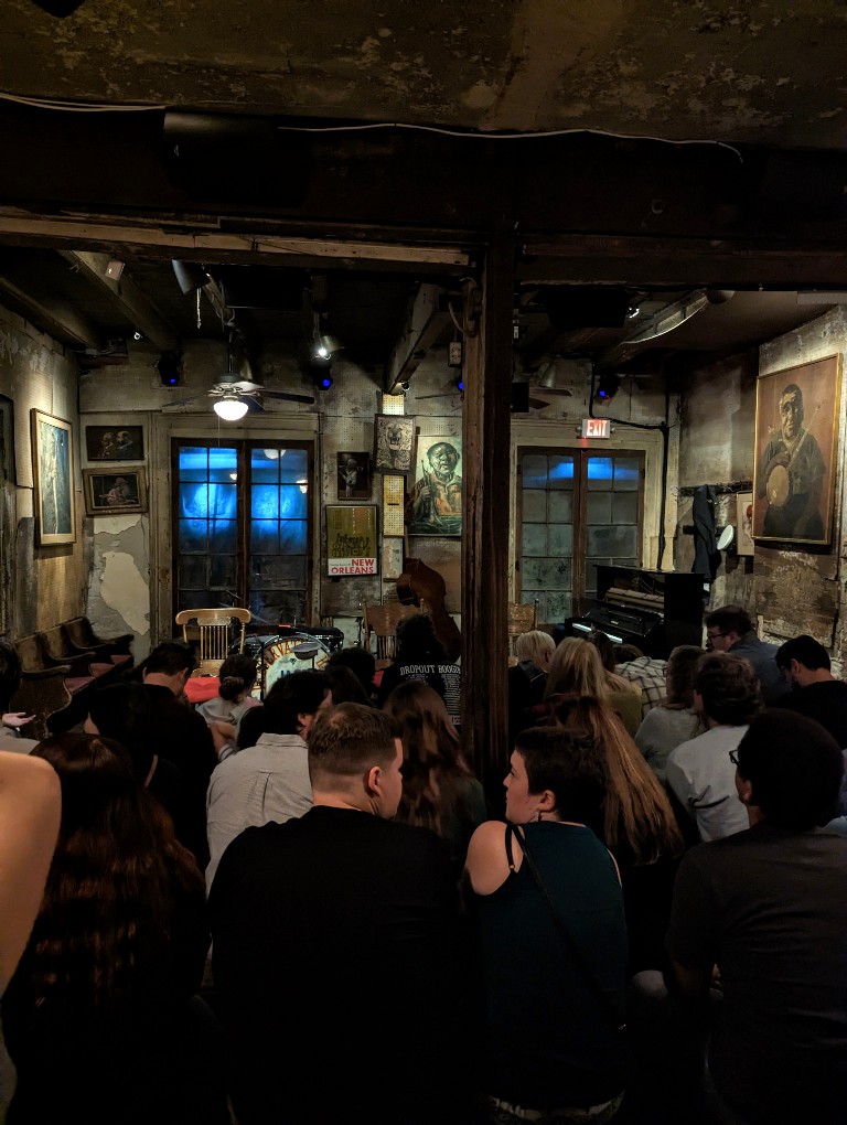 Old paintings, wooden benches, and a standing room only area make Preservation Hall a unique way to enjoy New Orleans jazz