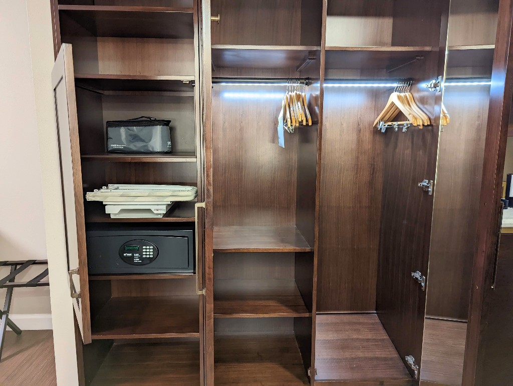 Disney's Yacht Club spacious closets are well organized with multiple compartments