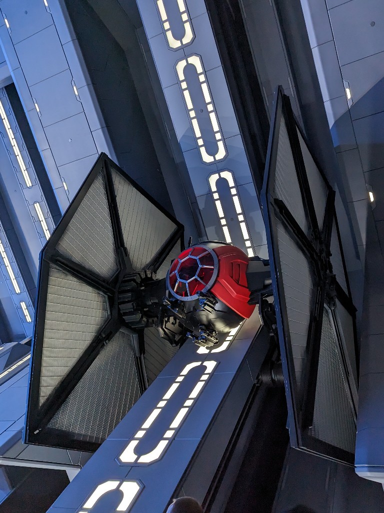 A tie fighter embedded in the Rise of the Resistance queue is an impressive sight