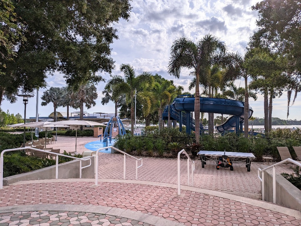 A splash pad and winding water slide at Contemporary Resort's feature pool