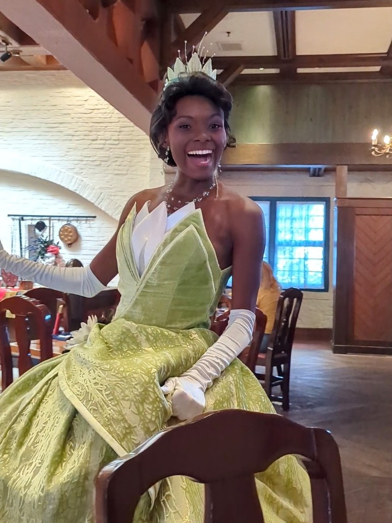 Tiana smiles widely as she approaches our table at Akershus