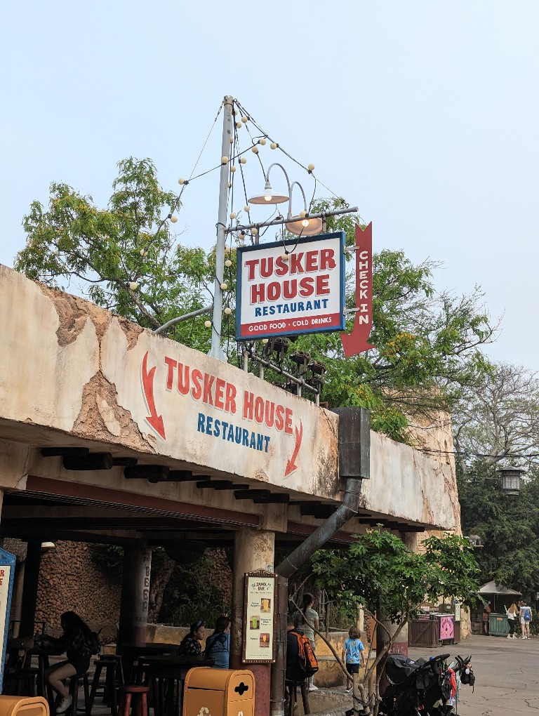 Tusker House entrance sign leads you to the check-in desk near Dawa Bar
