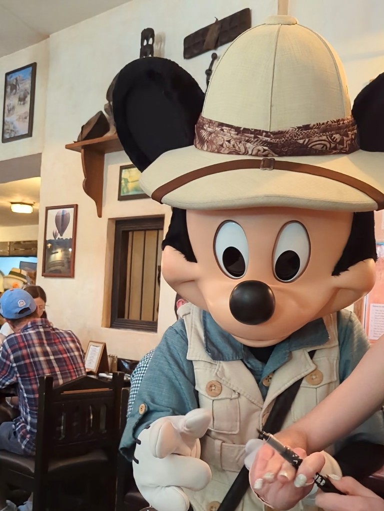 Mickey reaches for a pen to sign our autograph pillowcase