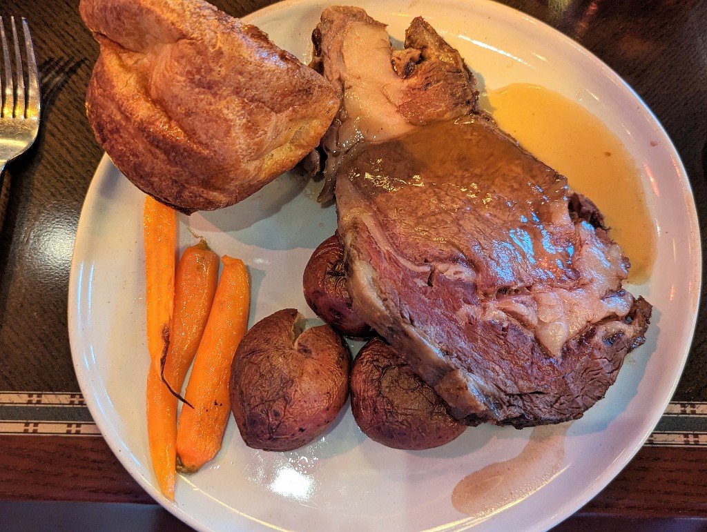 Prime rib, roasted potatoes and carrots, plus a large popover make for a filling entree at Story Book Dining