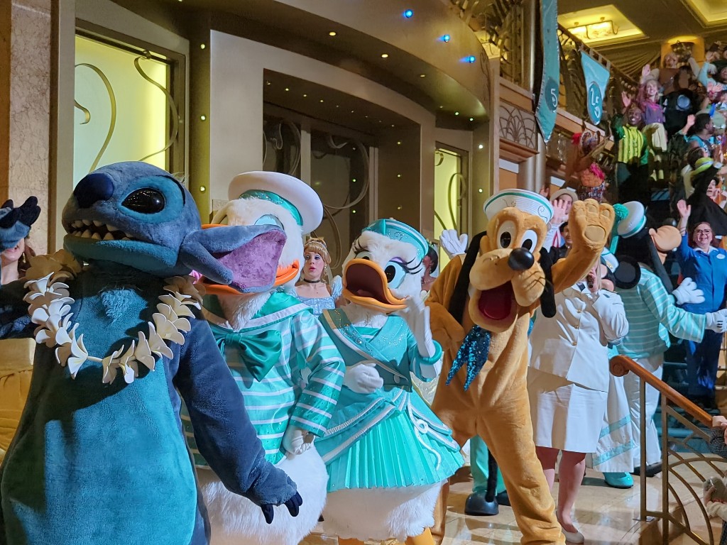Stitch, Donald, Daisy, Pluto, Cinderella, and more characters line up in the lobby on the last night for one last chance for Disney Cruise Line character meet and greets during 'Til We Meet Again