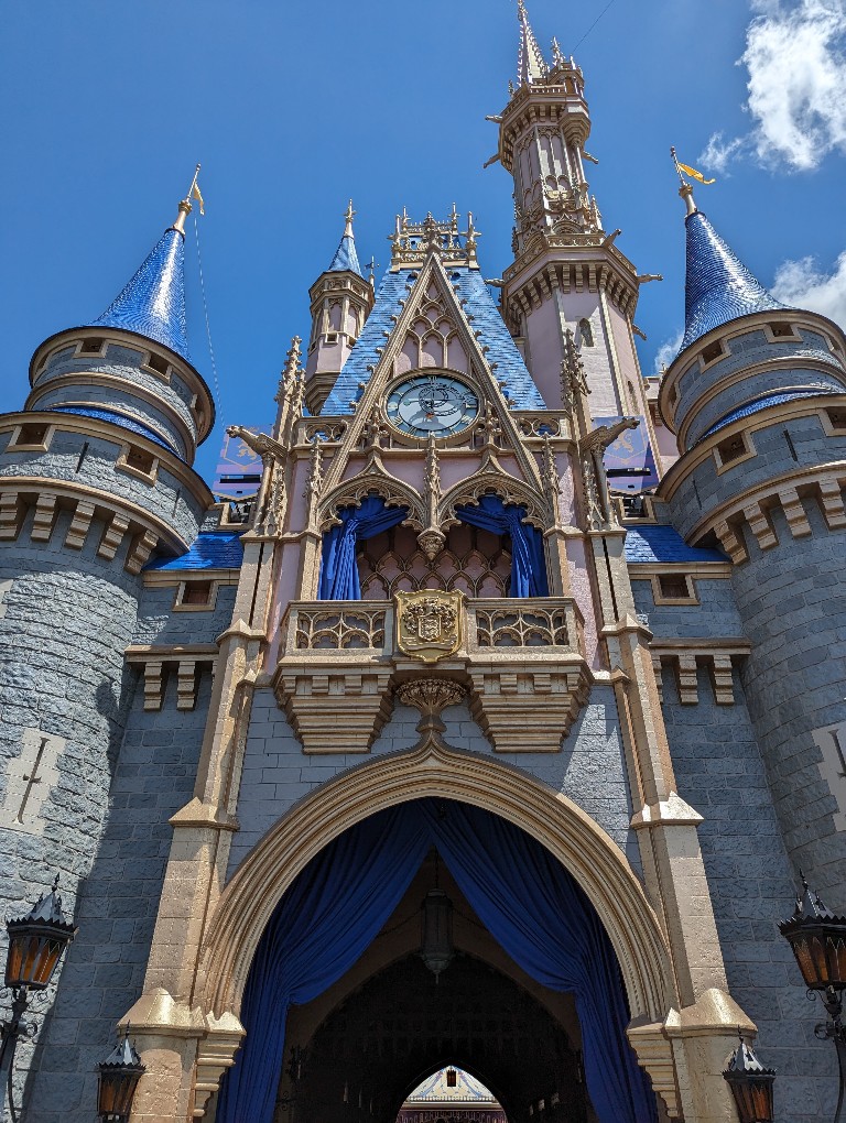 A forced perspective view of Cinderella's Castle and the tunnel that leads to Cinderella's Royal Table princess meal