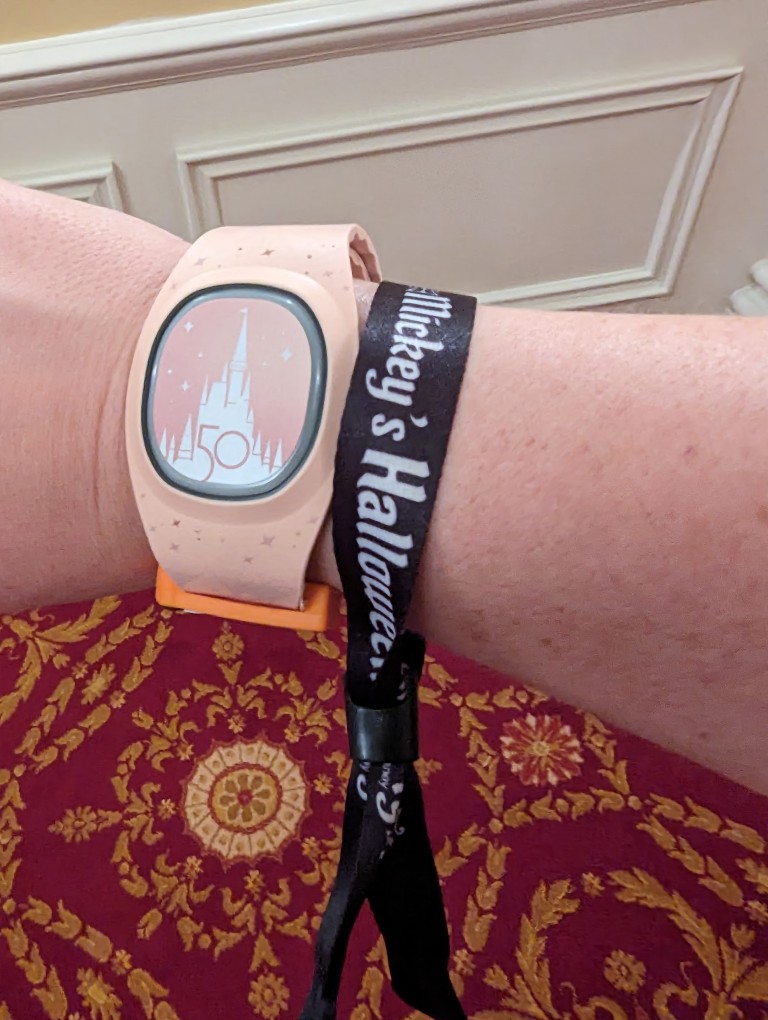 A fabric wristband shows cast members guests are eligible to participate in Mickey's Not So Scary Halloween Party