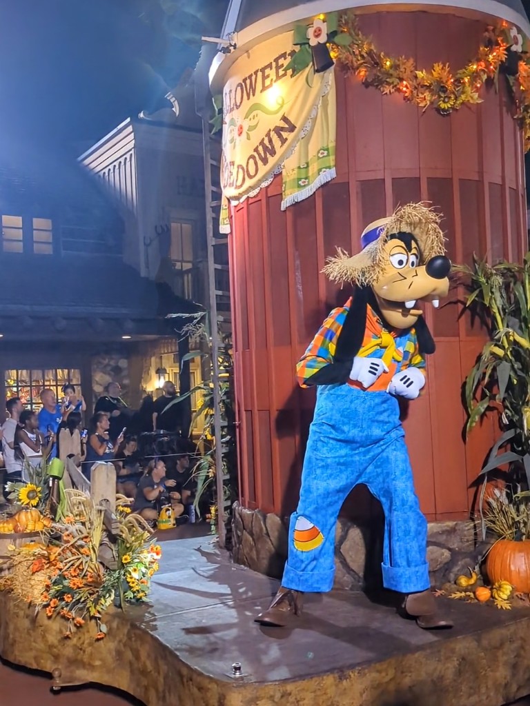 Goofy dances next to a silo during Mickey's Not So Scary Halloween Party Boo To You Parade