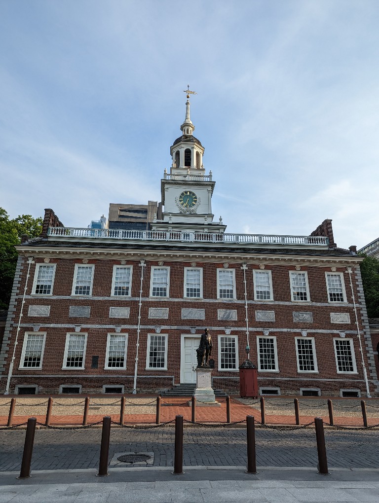 Independence Hall with traditional red brink, white window frames, and the iconic bell tower on top