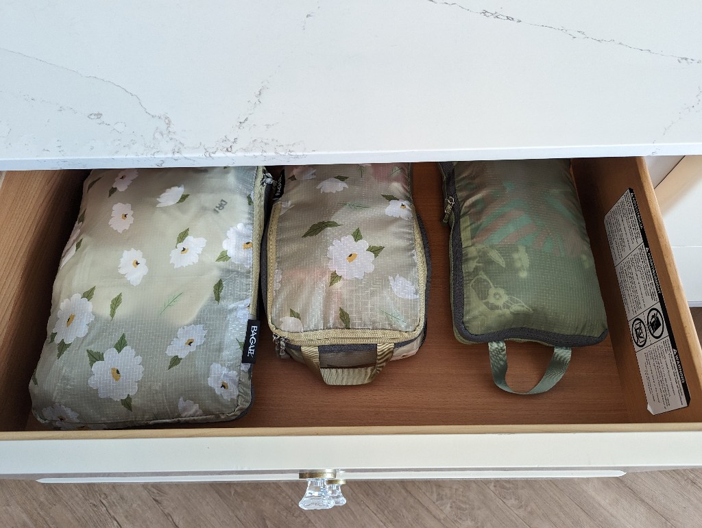 Three packing cubes lined up inside a drawer in Disney's Grand Floridian Resort rooms