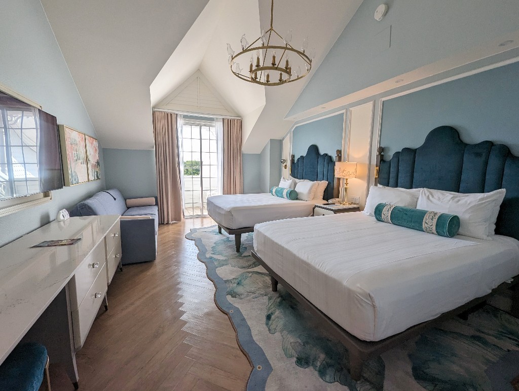 Newly remodeled Mary Poppins Grand Floridian Resort rooms decorated in shades of blue and white with gold and crystal accents