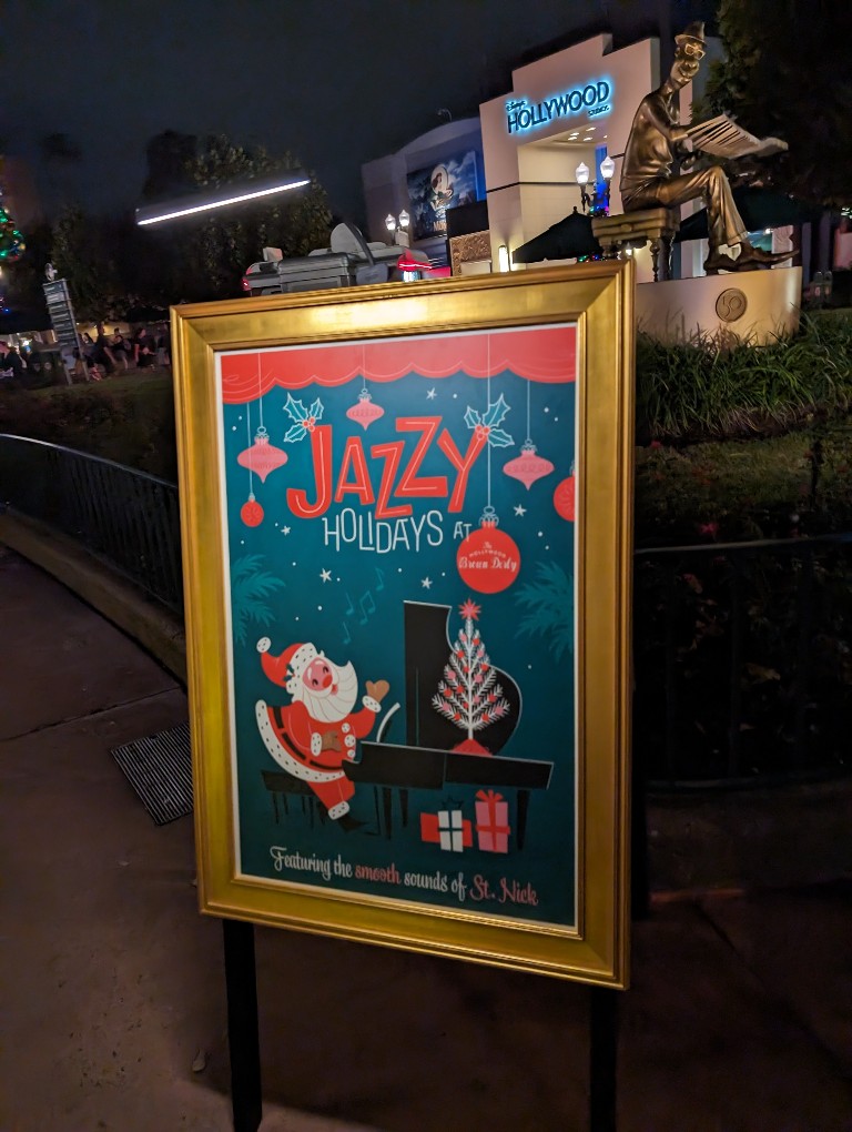 A gold framed picture of Santa playing a piano advertises Jazzy Holidays at Hollywood Brown Derby