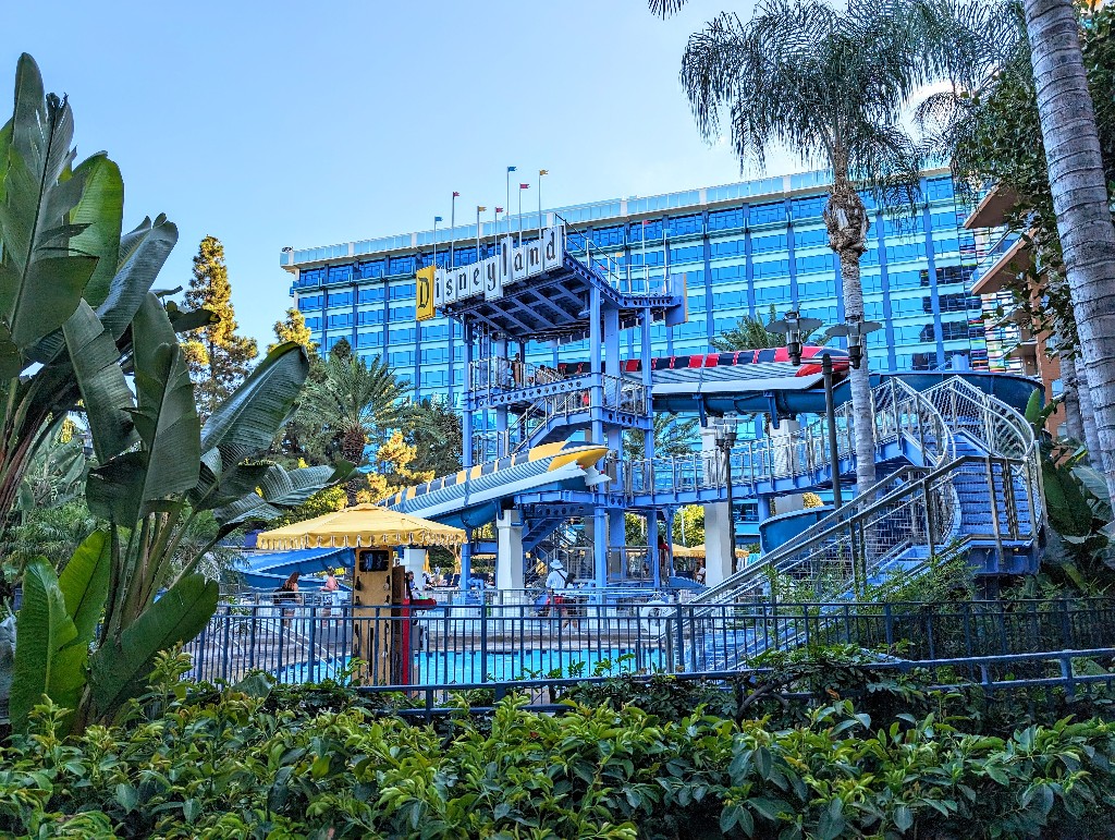 A replica Disneyland sign hang above the Monorail pool and water slides at Disneyland Hotel 
