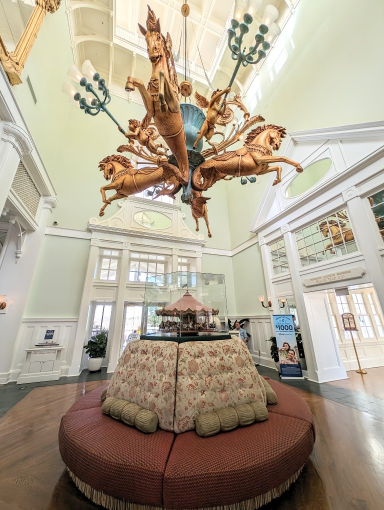 A golden quartet of carousel horses are an elaborate chandelier at the entrance to Disney's Boardwalk Inn