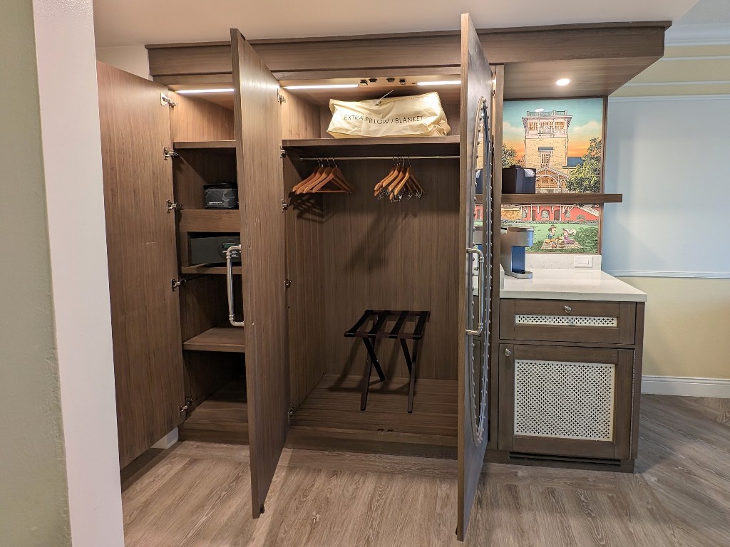 The closet is splint into two sections: one for hanging clothes and another with shelves from floor to ceiling that hold the in room safe at Boardwalk Inn