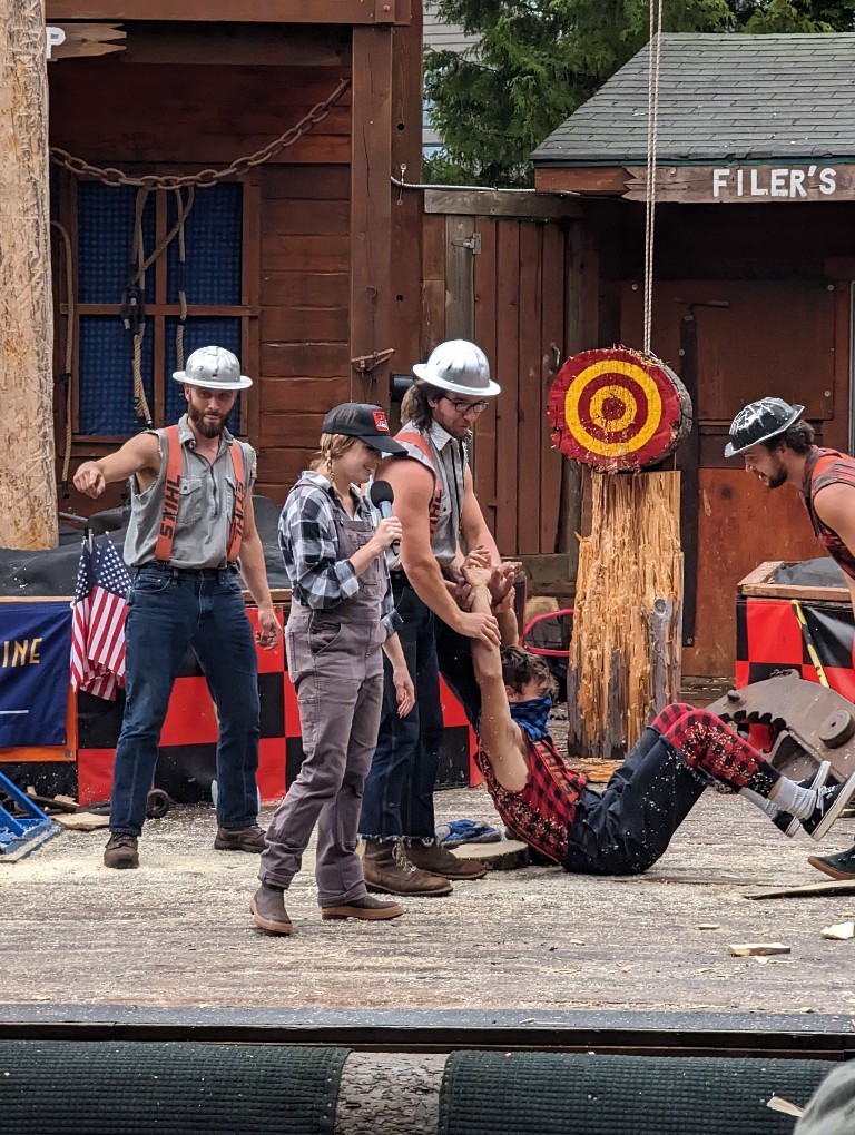 The mischievous lumberjack is caught by the competitors during the Great American Lumberjack Show