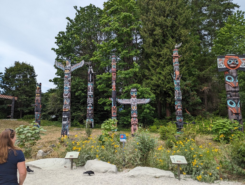 Totem poles representing Vancouver's indigenous people educate visitors in Stanley Park