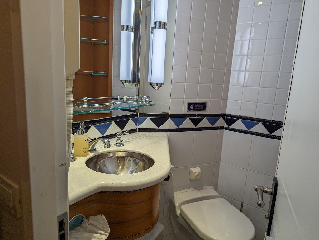 Disney Wonder stateroom bathroom with small vanity and sink