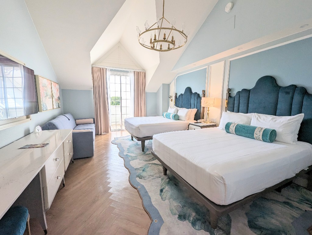 Shade of blue and subtle Mary Poppins inspired decor transform Disney's Grand Floridian standard rooms into a charming oasis