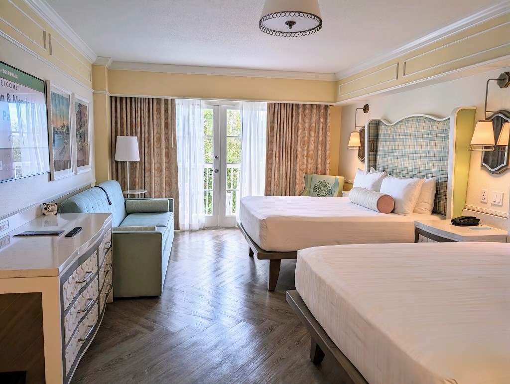 Green and yellow plaid headboards, cheerful yellow walls, and adorable Disney inspired art make the new Disney's Boardwalk Inn rooms a wonderful place to stay