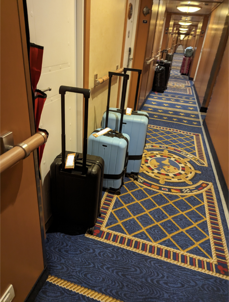 Suitcases line the hallways outside Disney Wonder on Disney Alaska cruise embarkation day