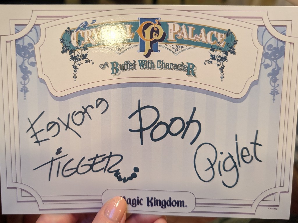 Autograph card given to guests at The Crystal Palace features signatures from Eeyore, Tigger, Piglet, and Winnie the Pooh on one side and pictures of the characters on the other