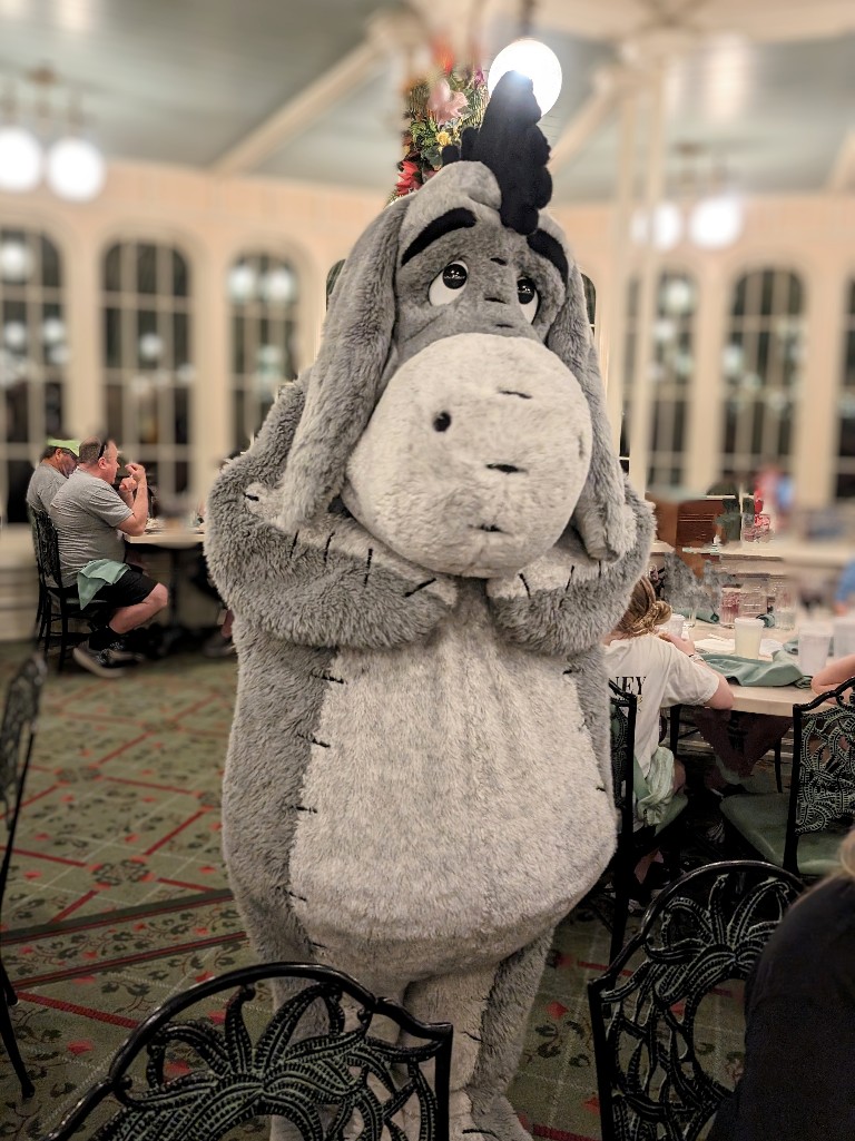Eeyore approaches a table shyly at The Crystal Palace